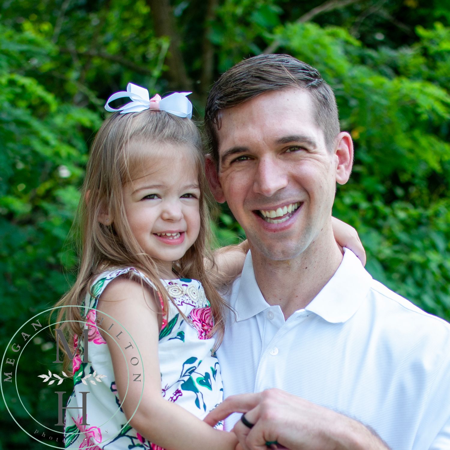 Dad and toddler daughter together with big smiles photograph.