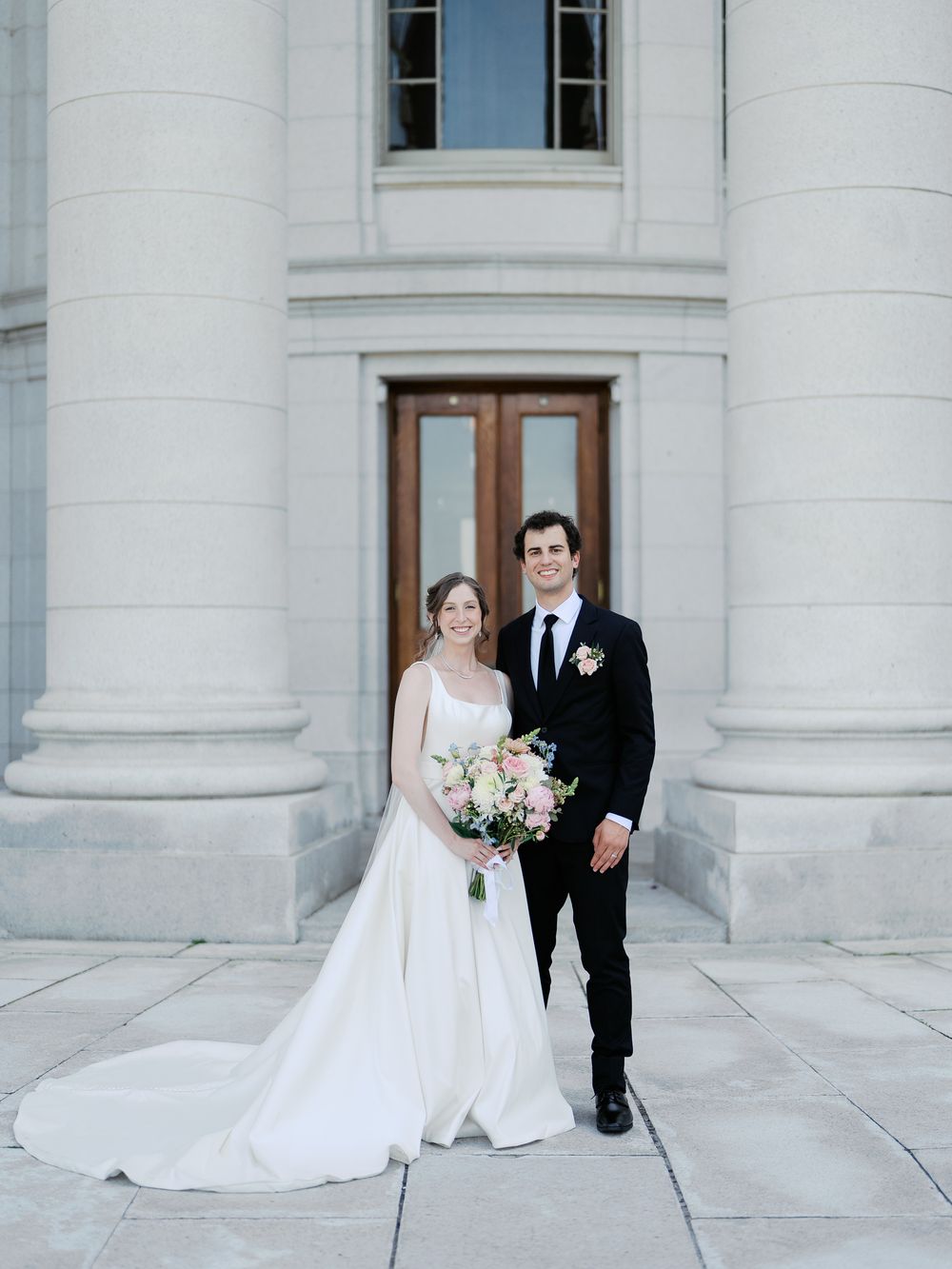 A series of wedding photos showing a bride and groom posing in front of an elegant white stone building with columns.