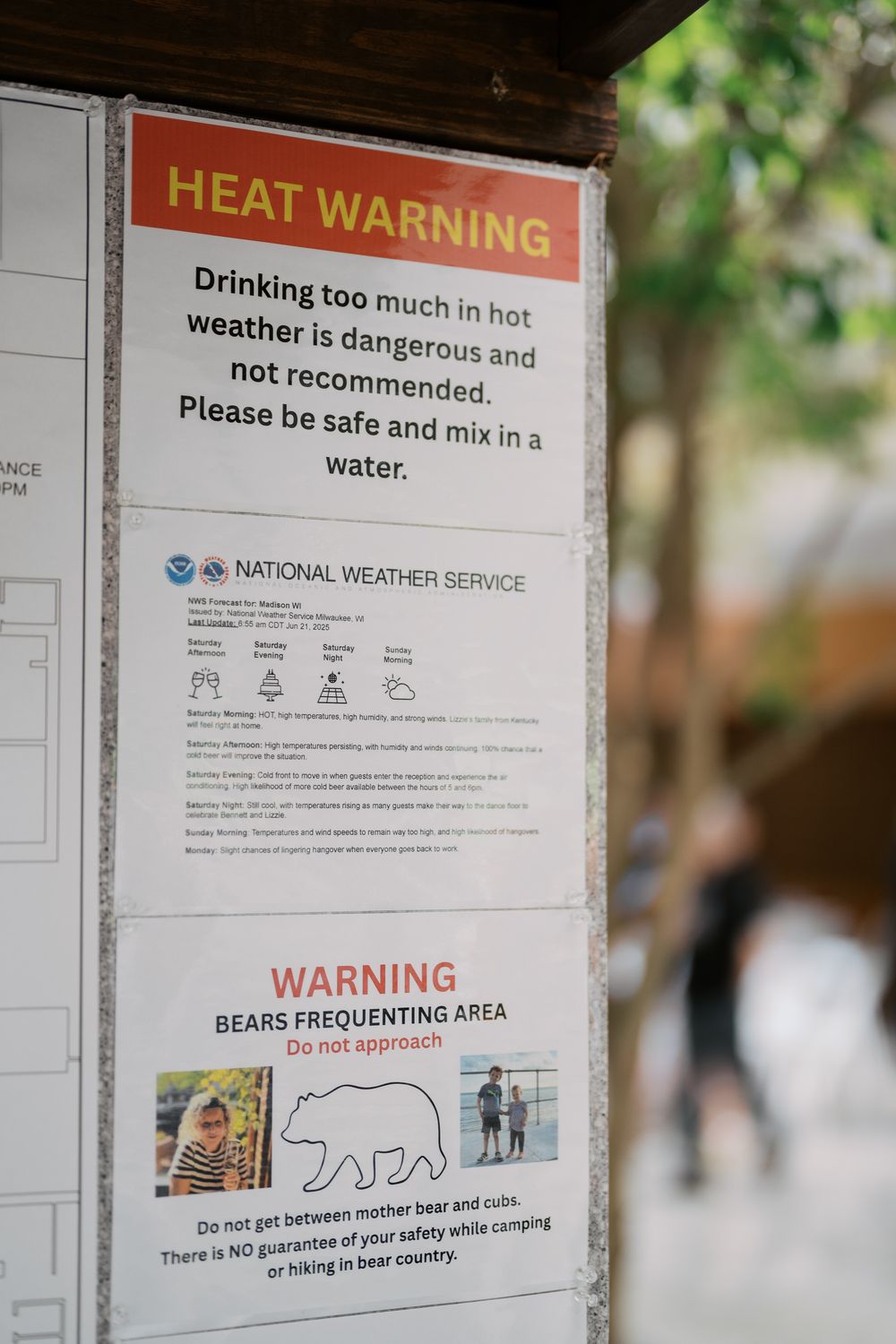 Warning signs posted on board showing heat warning and bear safety notices from National Weather Service.