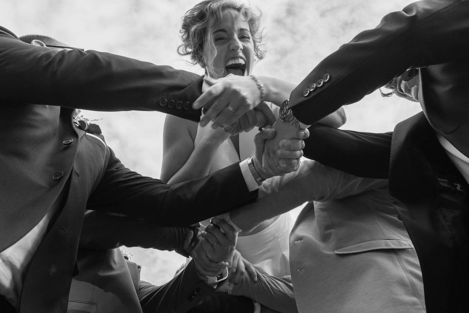 A series of black and white photographs depicting fist fights between figures in dim lighting.