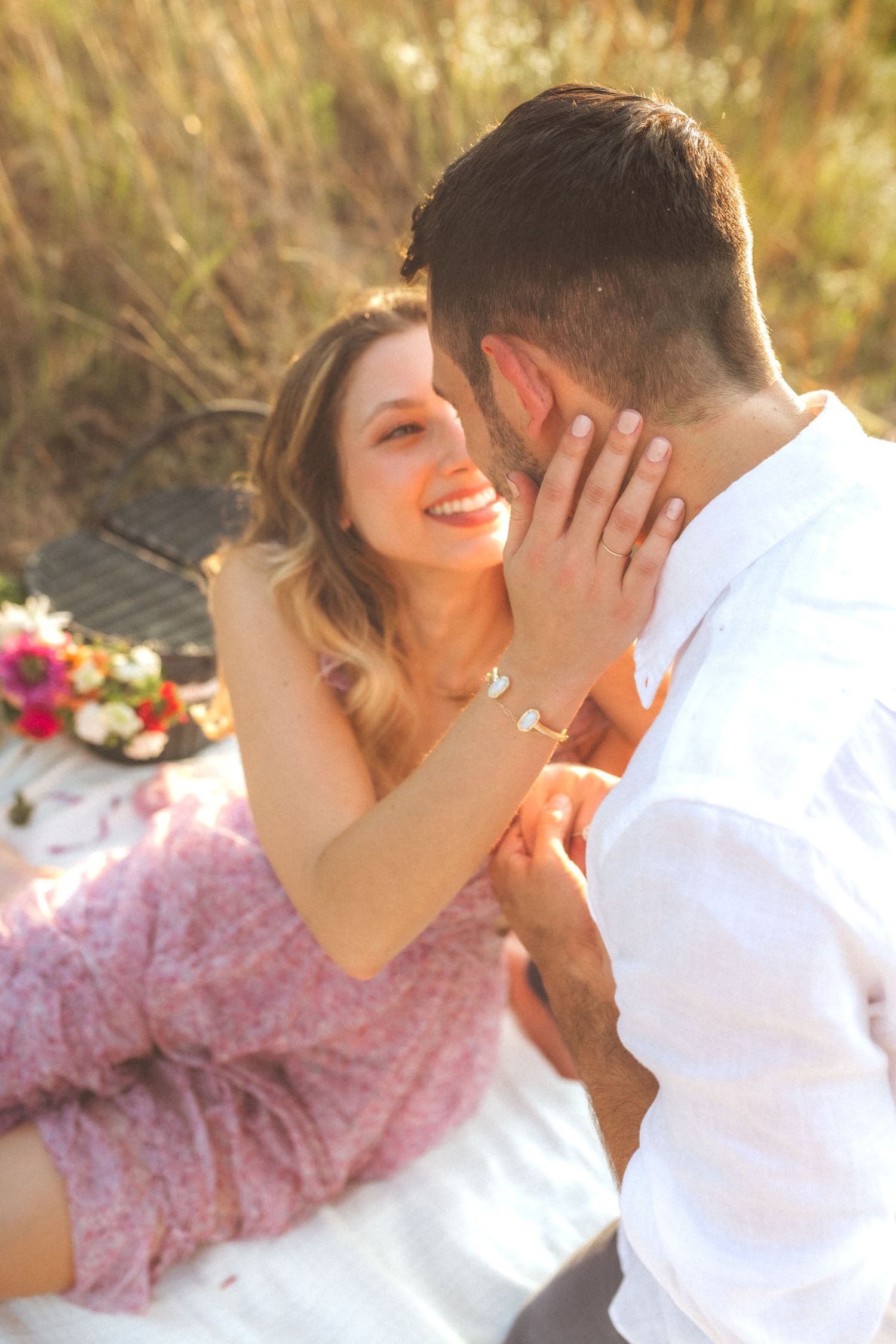 Two people share intimate moments in golden sunlight through a gentle progression of romantic poses.