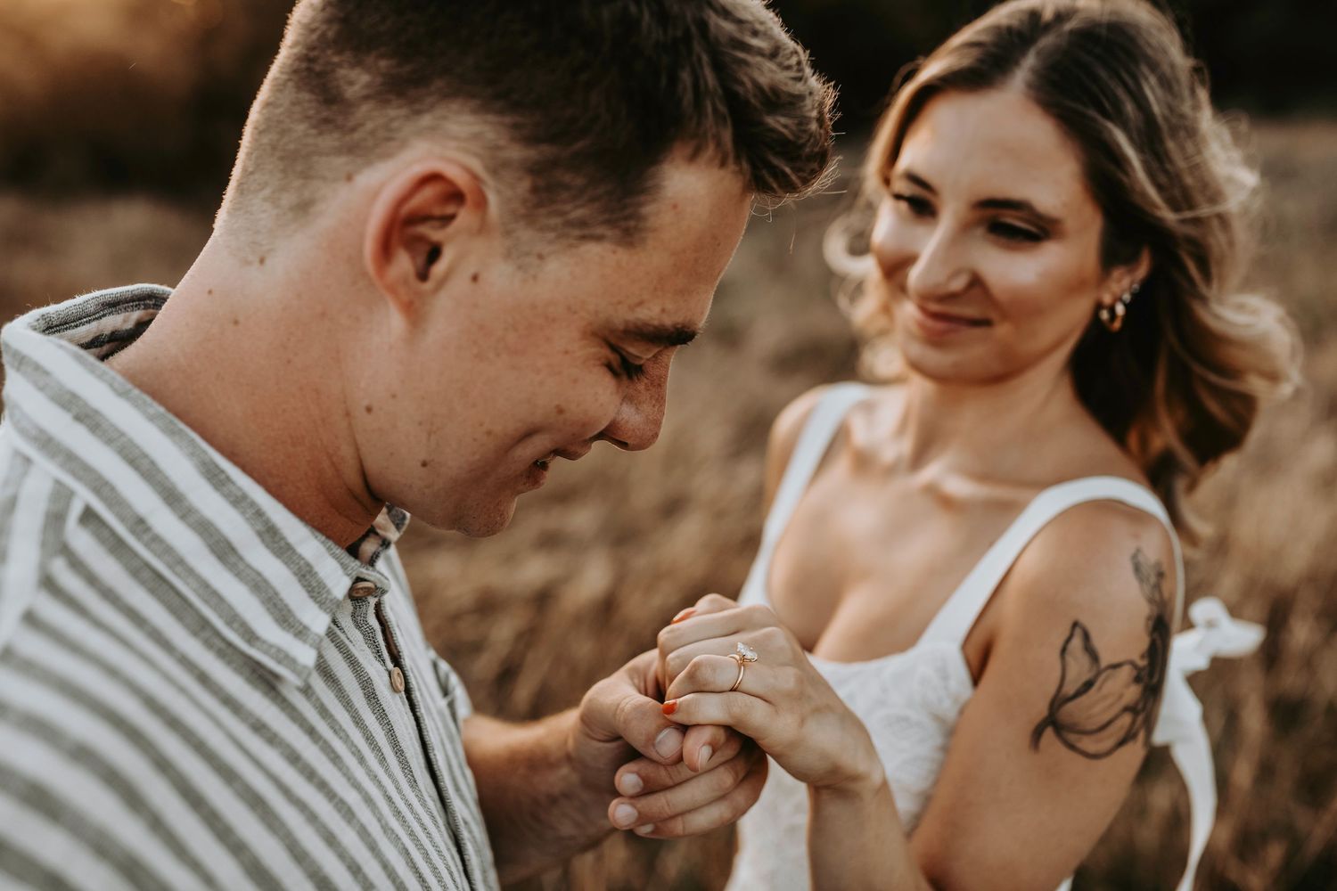 Couple sharing a quiet moment in nature bathed in golden light
