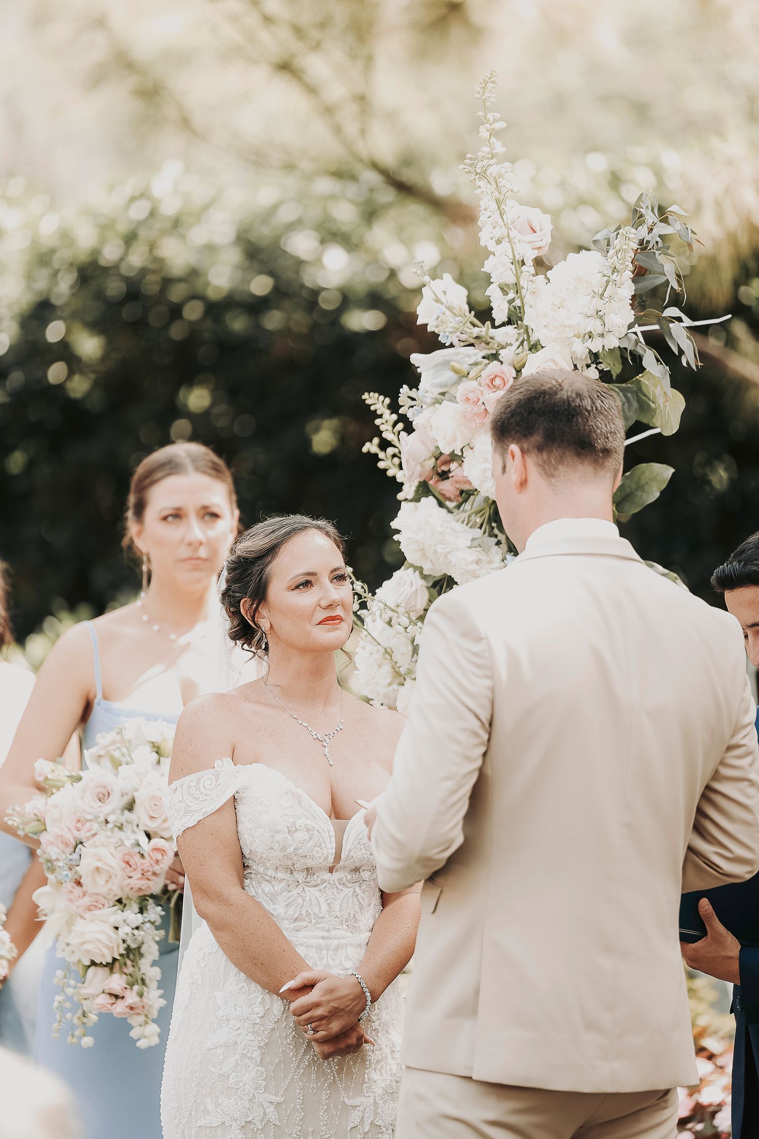 Bride smiling through tears during vow exchange in Stockyards wedding
