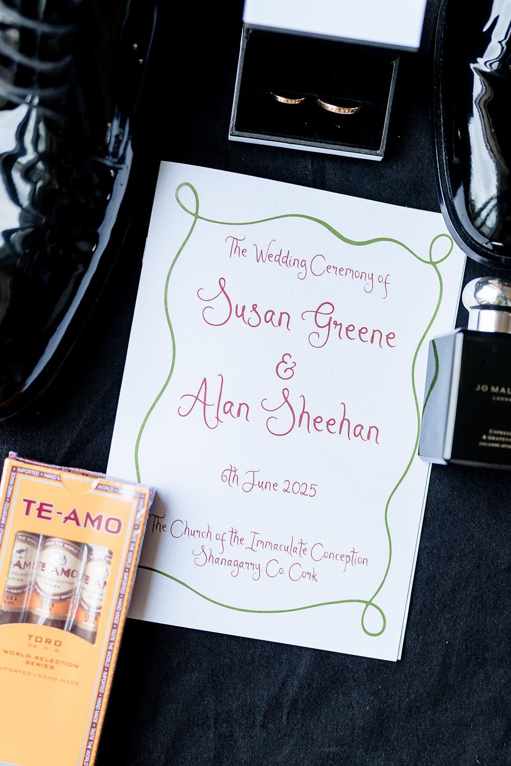 Wedding invitation cards and ceremony programs displayed on a black background with elegant cursive handwriting.
