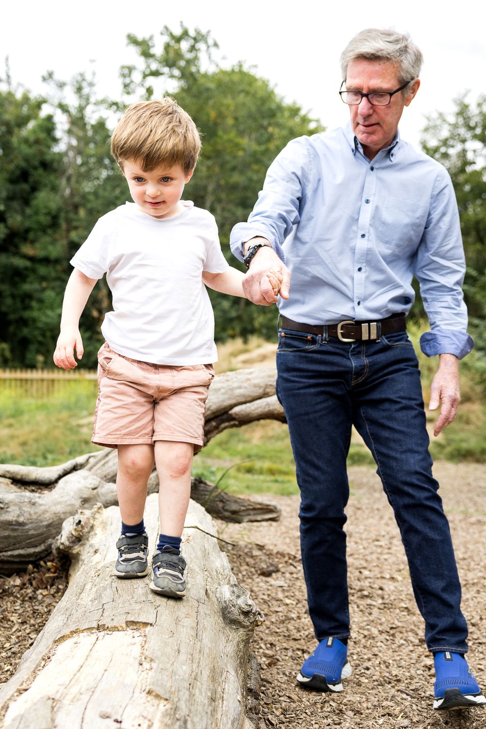 grandad holding hands with grandson