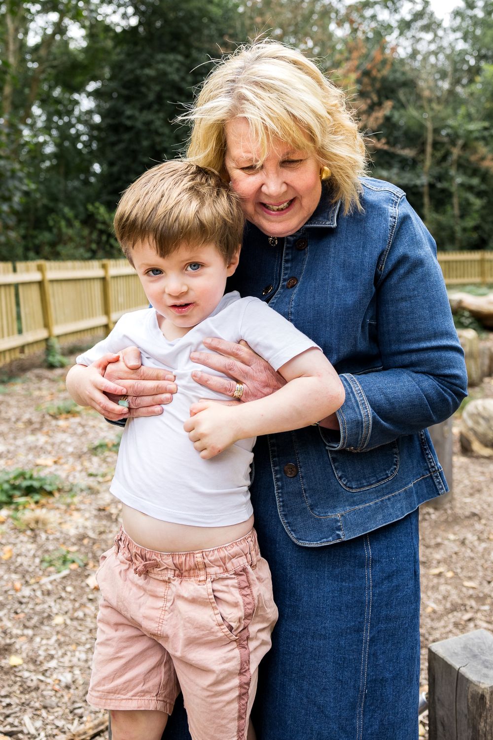 grandmother hugging grandson