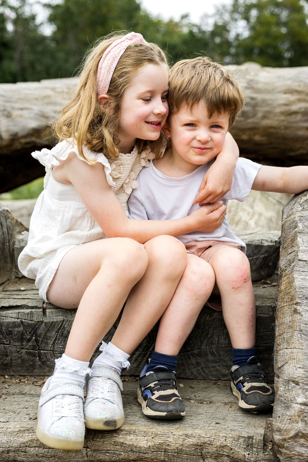 brother and sister hugging