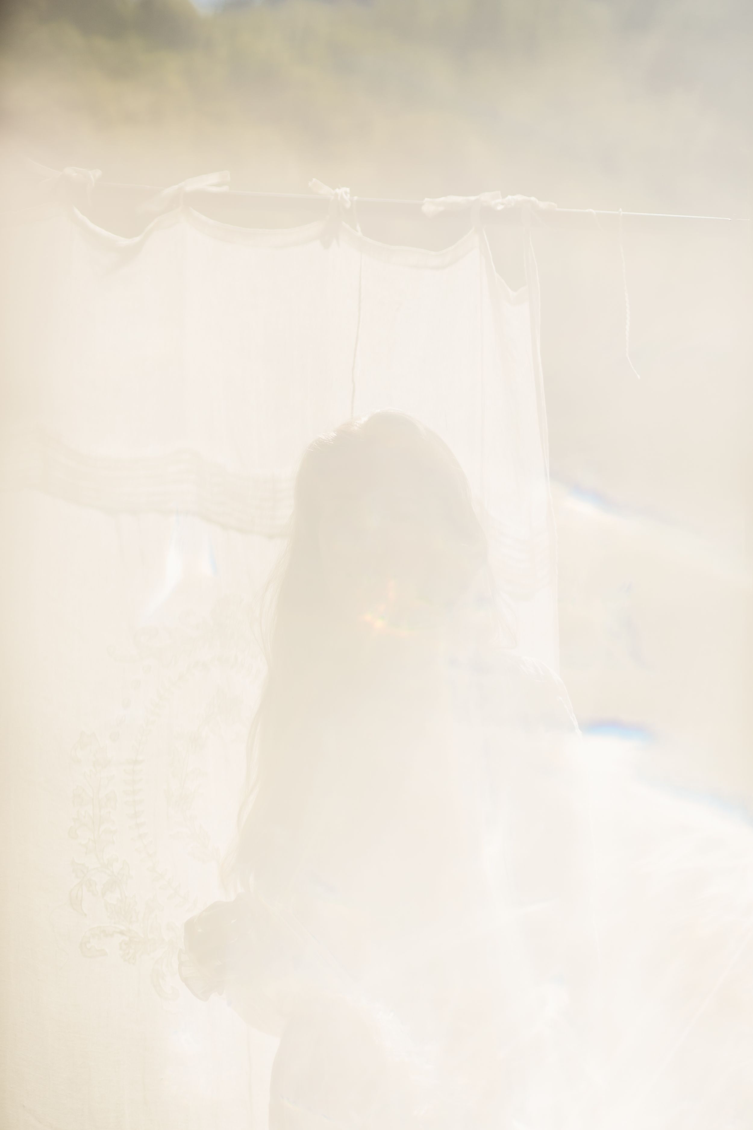 Abstract blurred beige and white background with soft gradient texture and ethereal lighting effects.