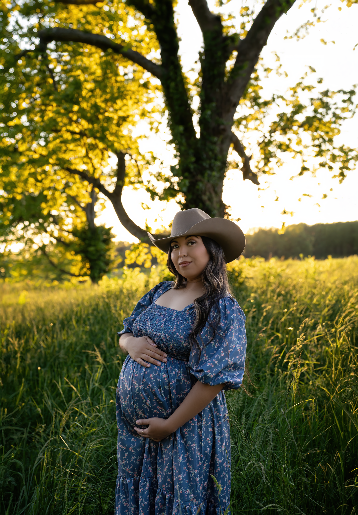 A golden hour maternity session in the Kentucky fields capturing a growing family’s love as they await their second baby boy, photographed b