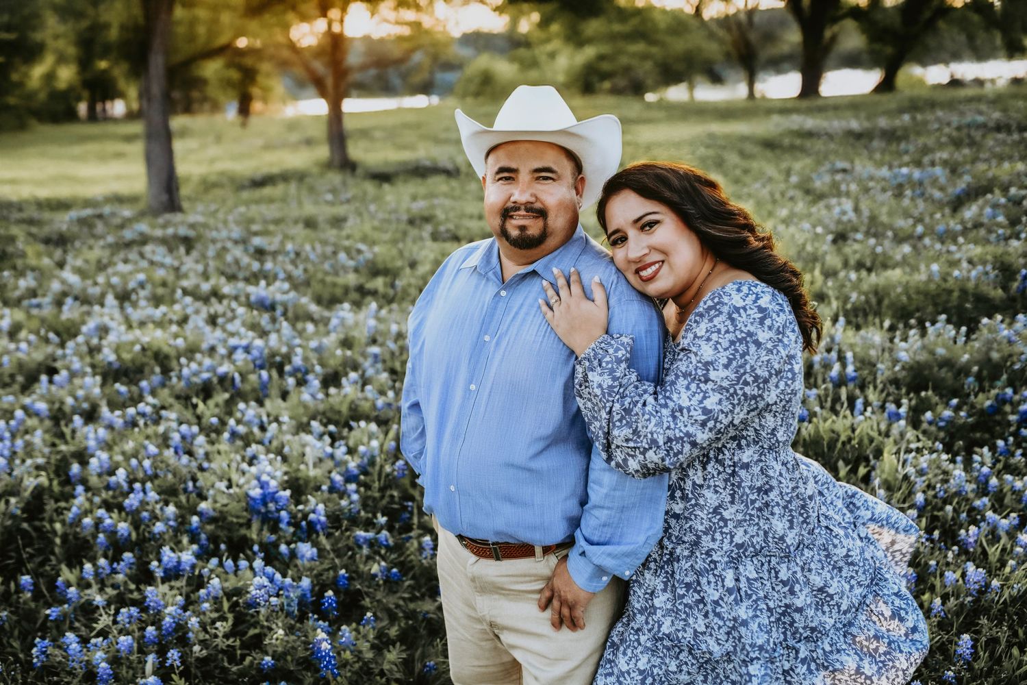 Intimate moment captured in bluebonnets with golden hour light on the lake at Ennis
