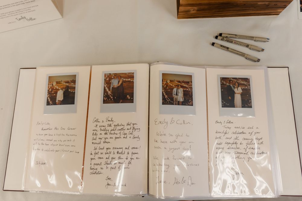 Photo album displayed on white background showing vintage polaroid-style photographs arranged in protective sleeves.