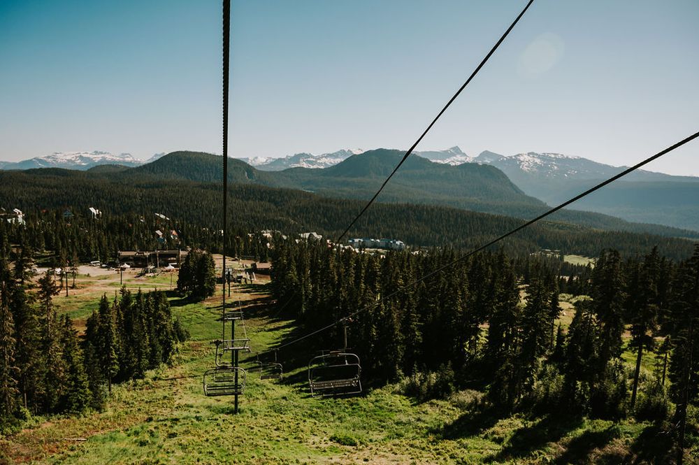Couple photoshoot riding scenic chairlift Mt Washington to mountains. Photography by Photographer Soulfull Photographs