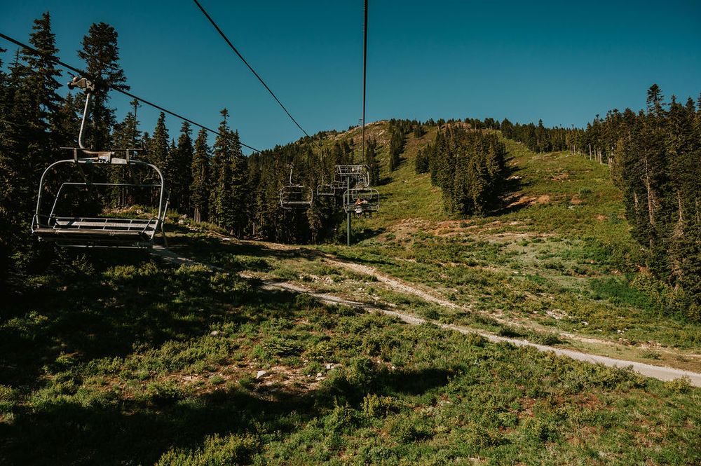 Couple photoshoot riding scenic chairlift Mt Washington to mountains. Photography by Photographer Soulfull Photographs