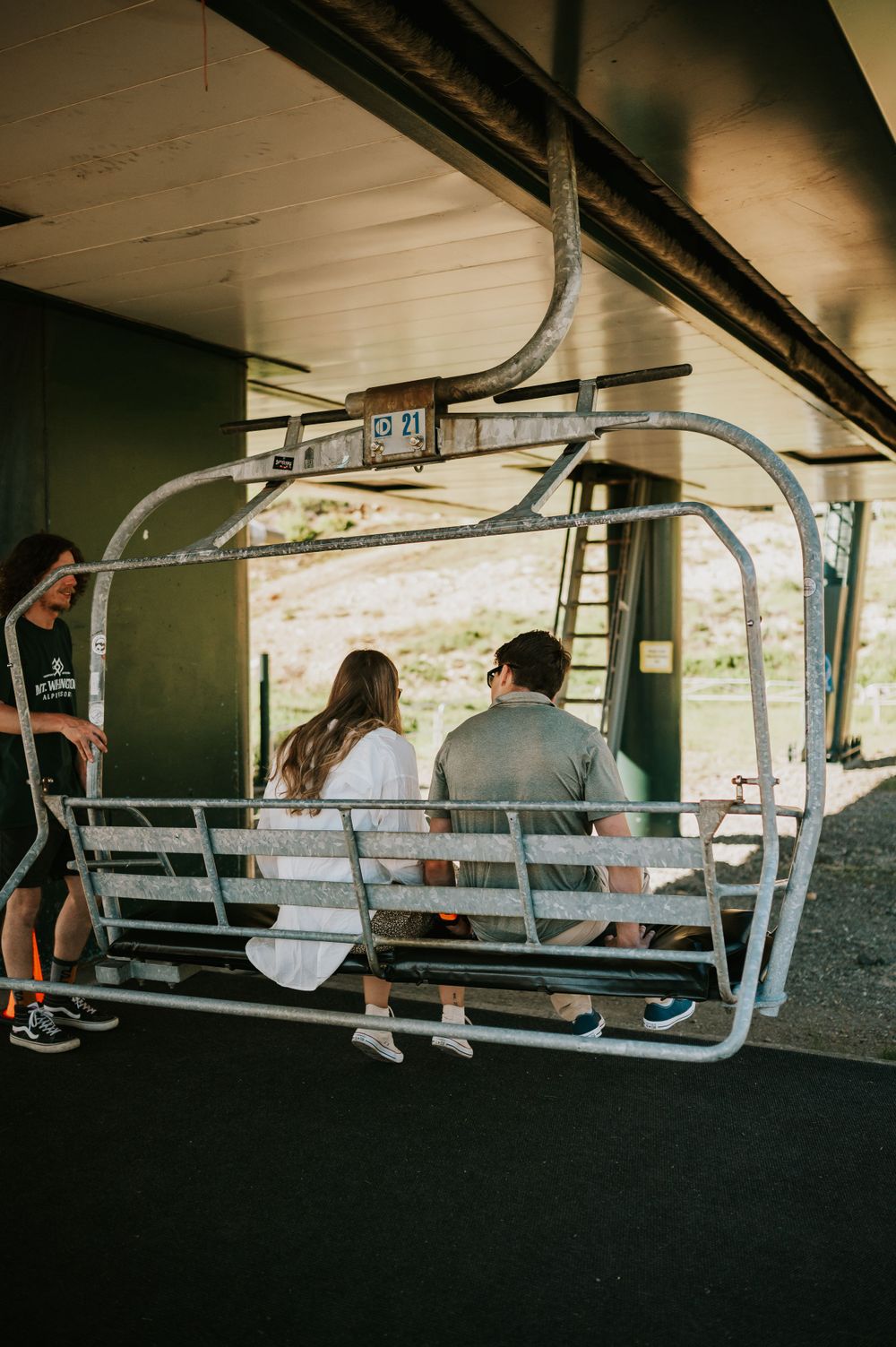 Couple photoshoot boarding scenic chairlift Mt Washington Vancouver Island. Photography by Photographer Soulfull Photographs