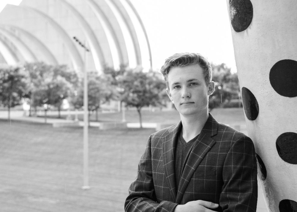 Modern architectural portrait with curved white arches in black and white style.