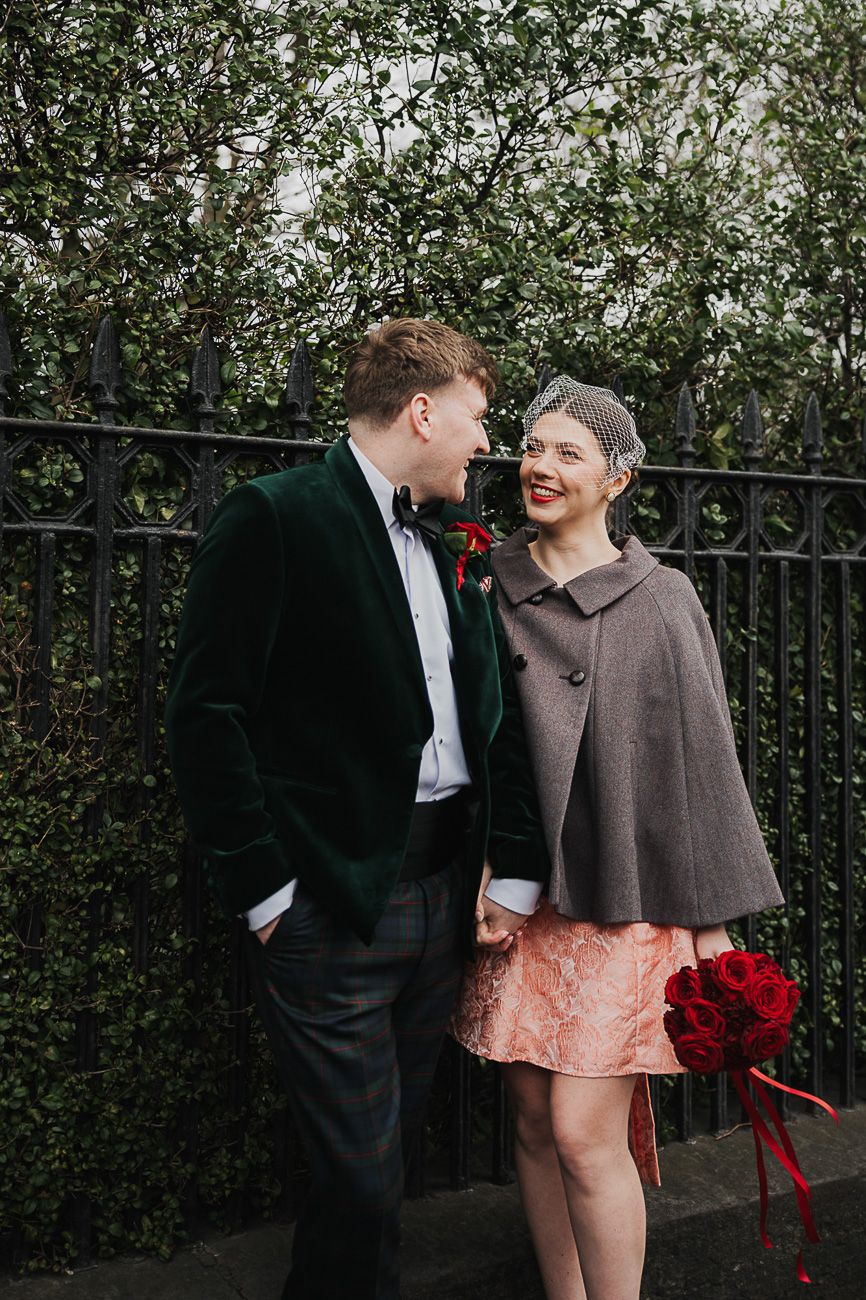 Romantic couple in vintage-inspired winter outfits pose together against greenery in progressive sequence of candid moments.