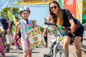 Cycling participants sharing a fun moment during outdoor biking event.