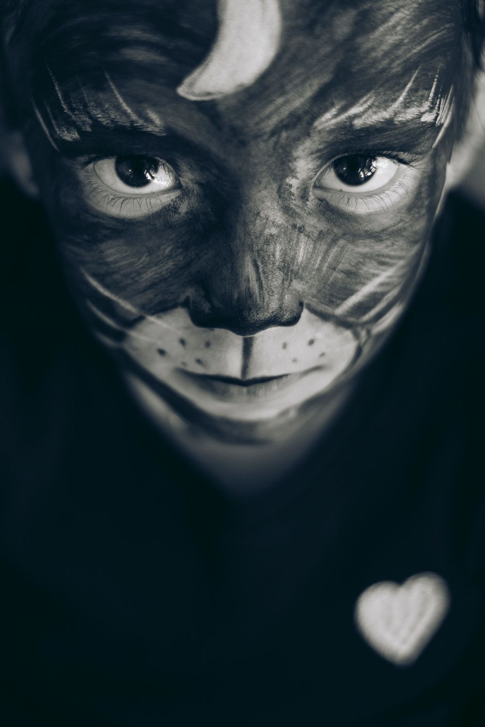 A series of dark and moody close-up photos with dramatic shadows creating an artistic, slightly sinister aesthetic.