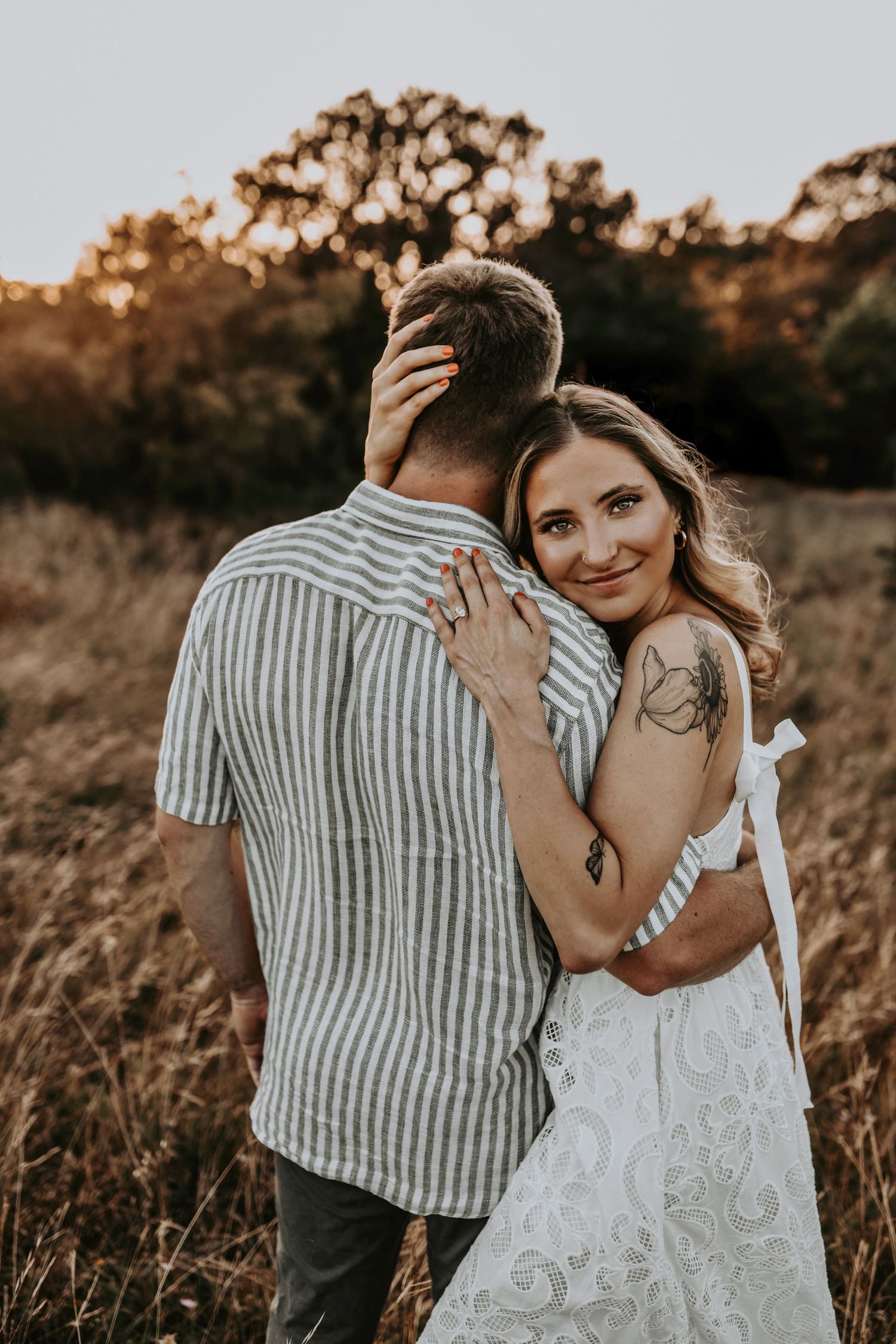 Energy-filled engagement moment with couple dancing in the Flower Mound fields
