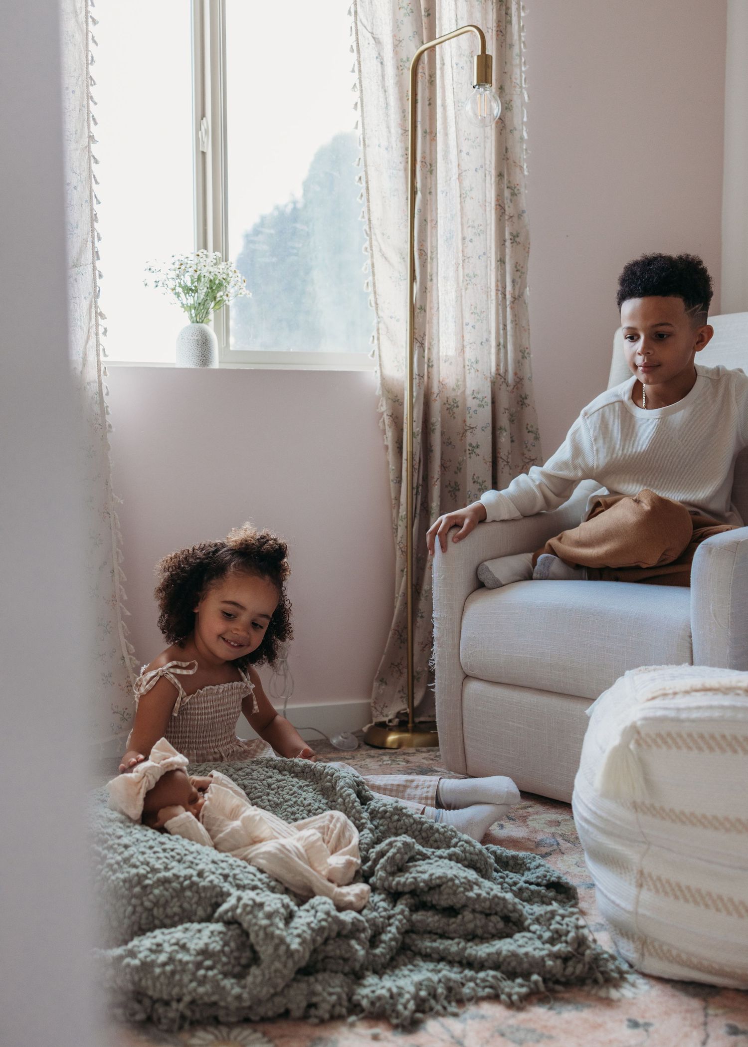 Three progressive images show two relaxed people lounging and having fun together under a cozy knit blanket.