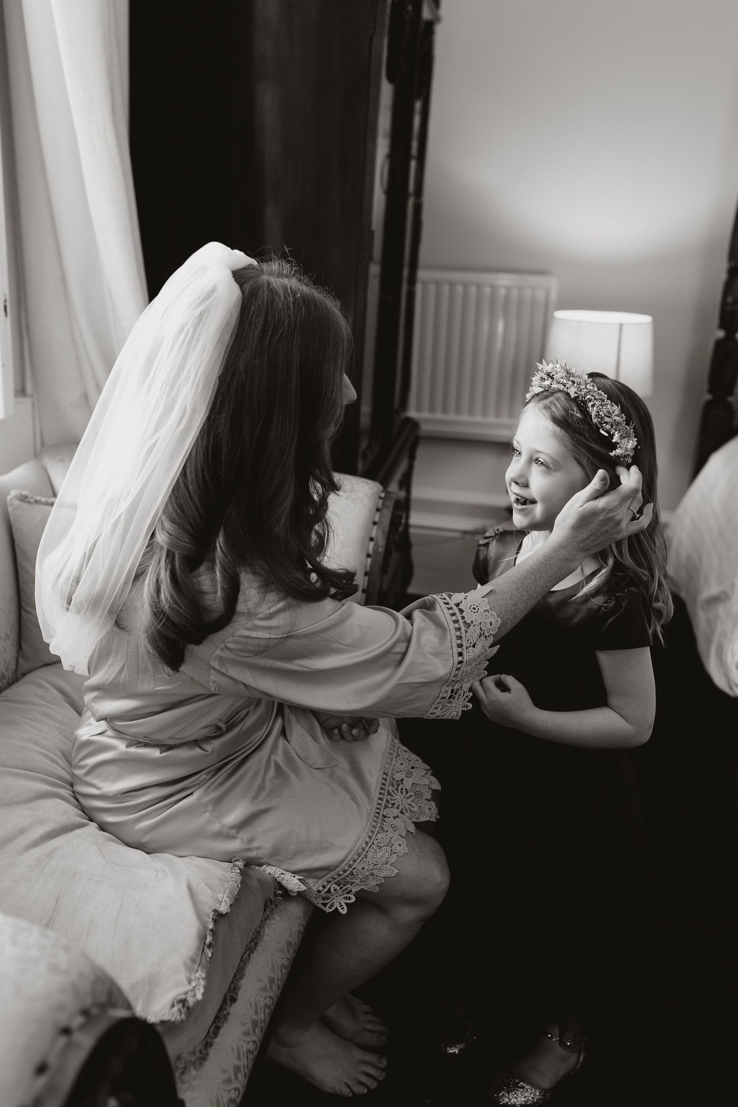 Black and white sequence of photographs showing bride getting ready with veil floating in graceful movement.