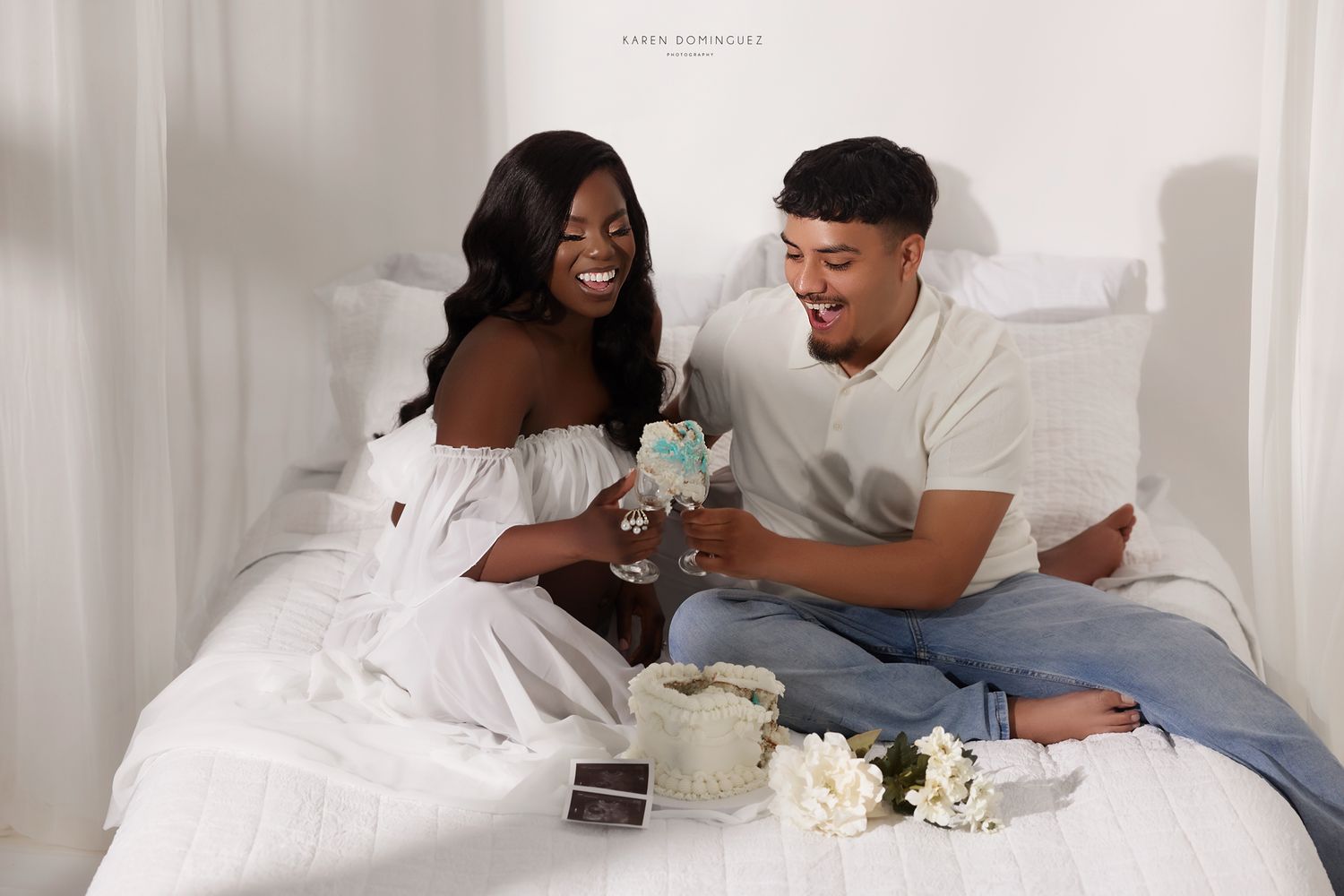 Gender Reveal with couple using cake, and champagne classes.