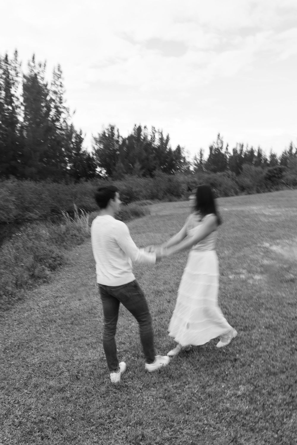 Woodsy couple photos at the West Delray Regional Park with a lake and tall trees during golden hour captured by Lindsay McDow Photography.