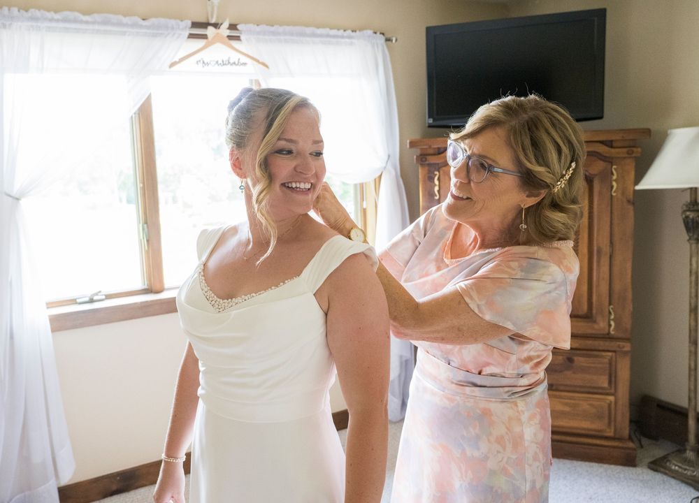 A series of getting ready shots on a wedding day with a beautiful white dress and veil.