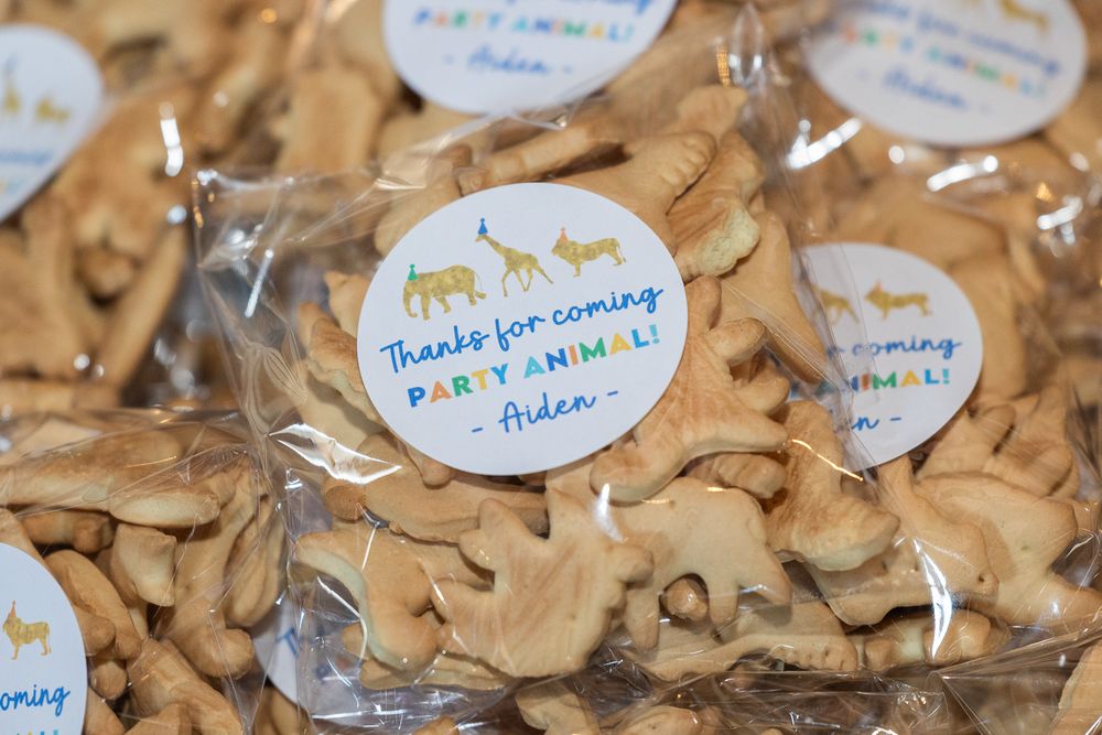 Small bags of animal-shaped cookies with thank you stickers.