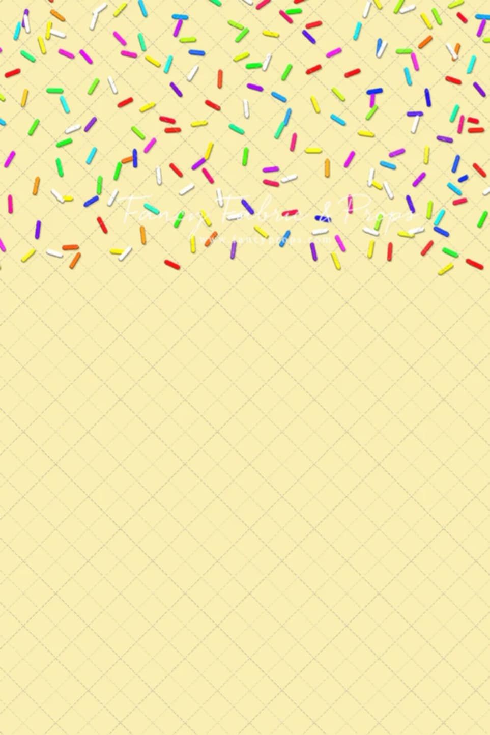 Colorful confetti sprinkles scattered on a pale yellow waffle cone textured background.