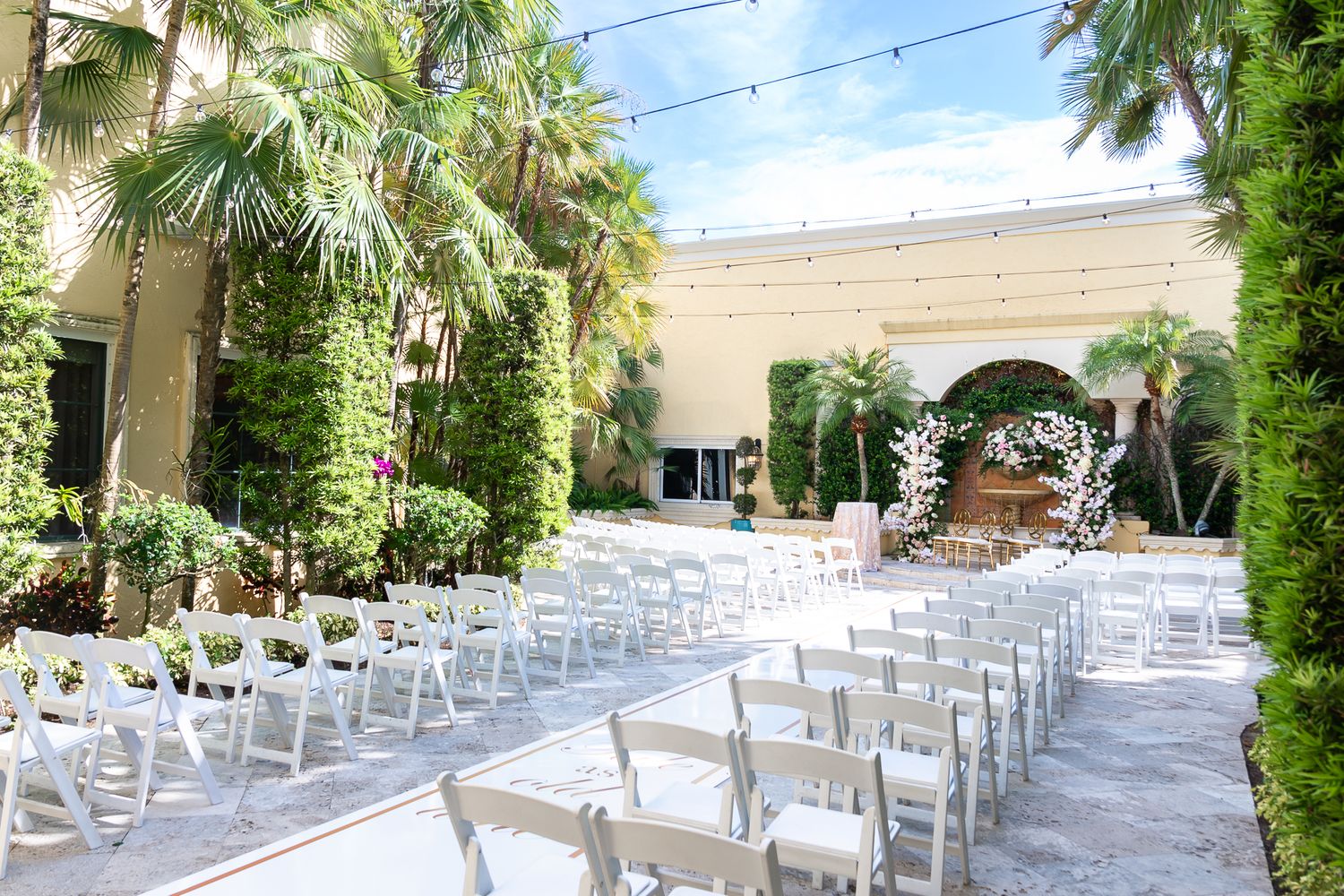 Boynton Beach wedding photographers capturing romantic walk by the water.