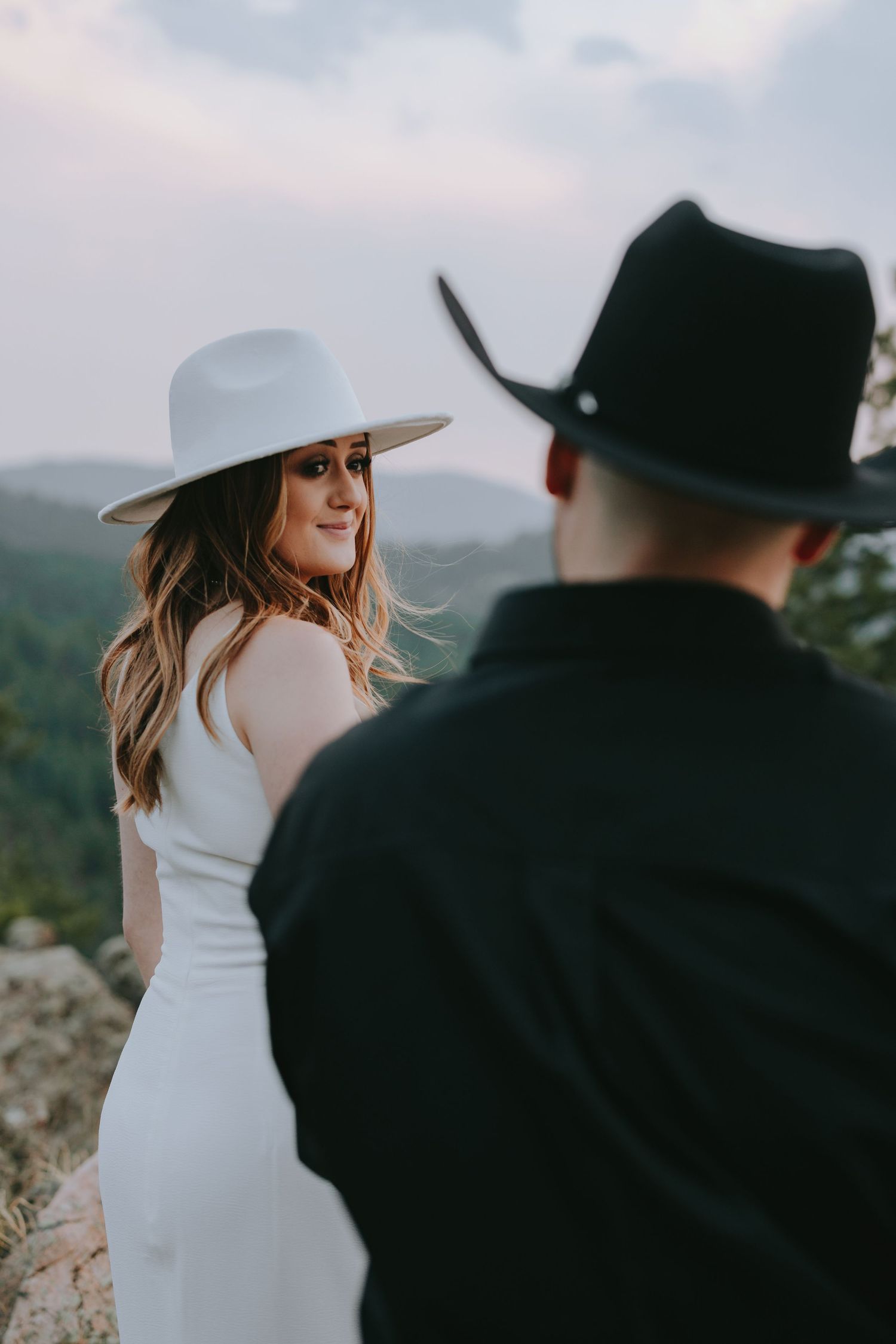 Joyful moment captured during sunset in a forest setting with warm golden light.