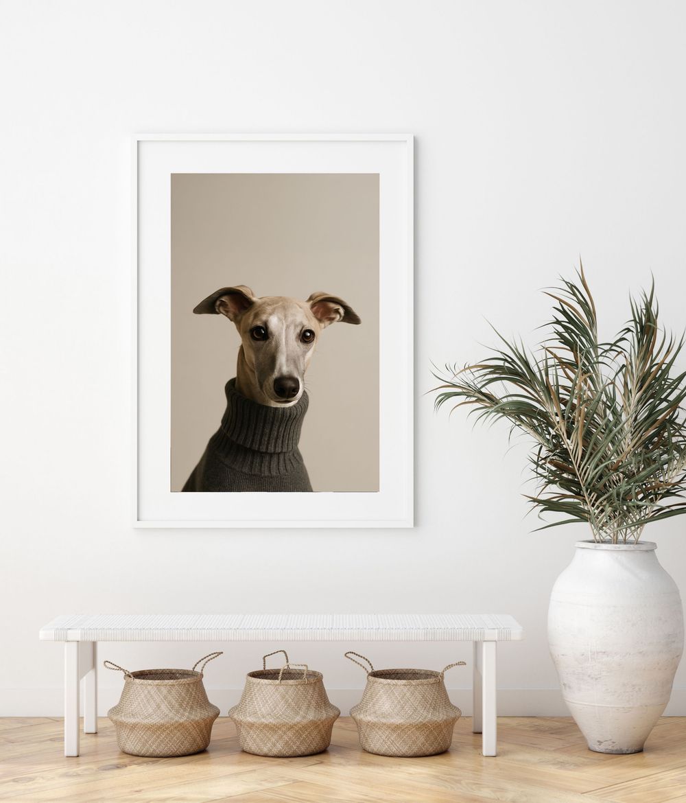 A white minimalist living room with framed artwork, woven baskets, and a palm plant in a white ceramic vase.