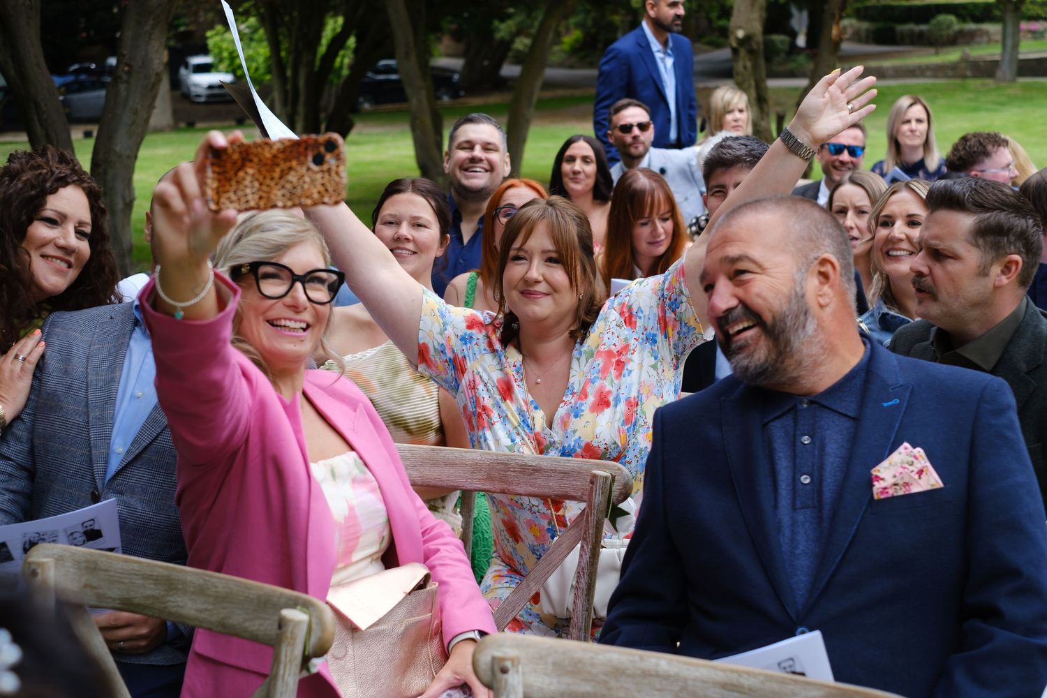 Guests having fun and taking selfies at the wedding