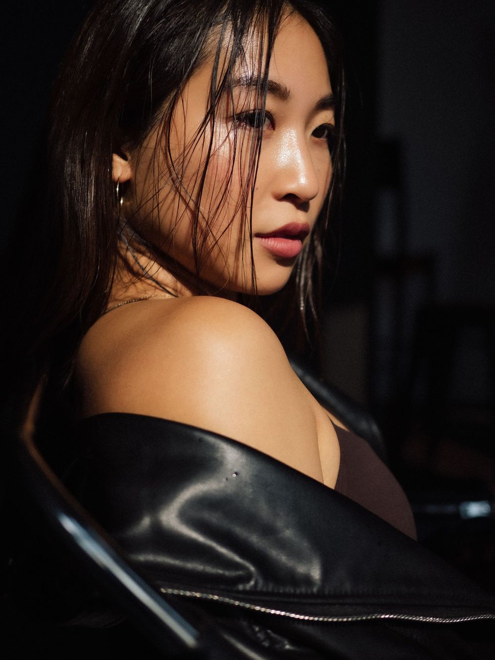 Artistic portrait series showing dramatic side profiles against dark background with leather jacket detail.