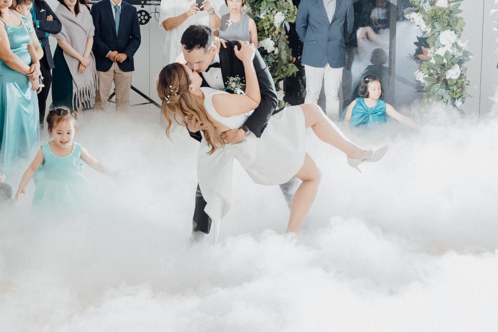 The bride and groom dance together surrounded by atmospheric fog effects captured by Apertured Media Auckland Wedding Photographer..