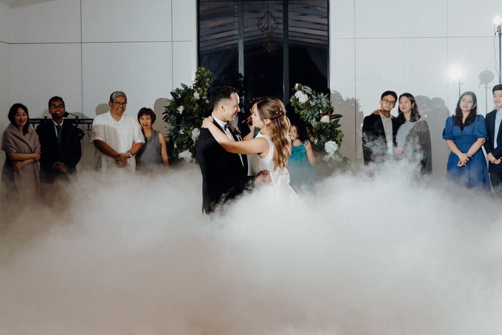A newly wedd at a wedding reception as fog covers the dance floor captured by Apertured Media Auckland Wedding Photographer.