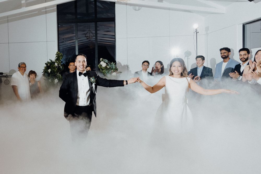Couple dancing together on misty dancefloor captured by Apertured Media Auckland Wedding Photographer.