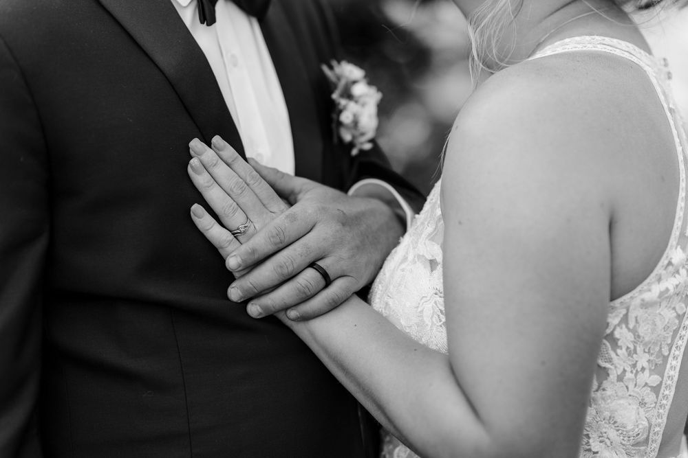 Detail shots capture hands, wedding rings and lace gown details during an intimate bridal photo session.