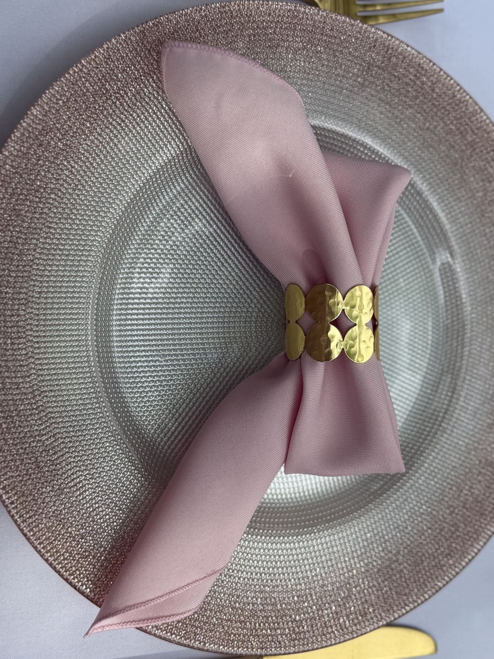Beautiful baby shower place settings and floral garland designed by Columbus event planning team