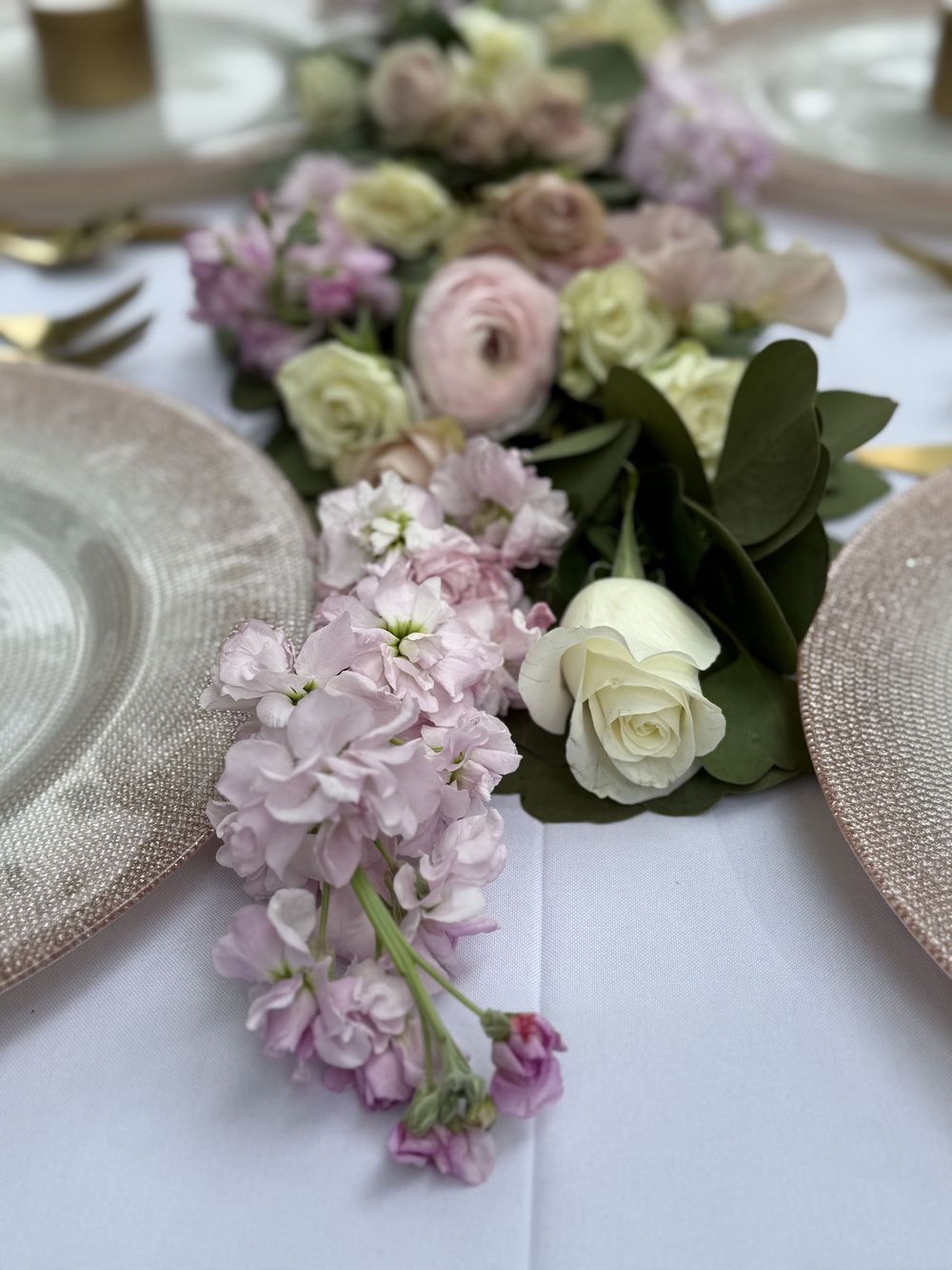 Columbus event planner sets up modern baby shower tablescape with blush and neutral tones