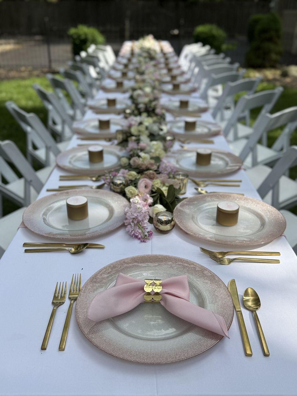 Elegant baby shower table setup with floral centerpieces by event planner in Columbus, Ohio