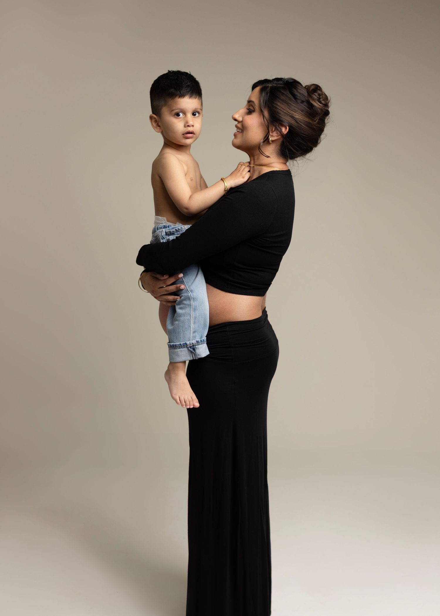 Gorgeous Rumneet awaits her new baby's arrival. Cloverdale. Surrey. Maternity Photography bump photos. Sleek black dress with cutout.