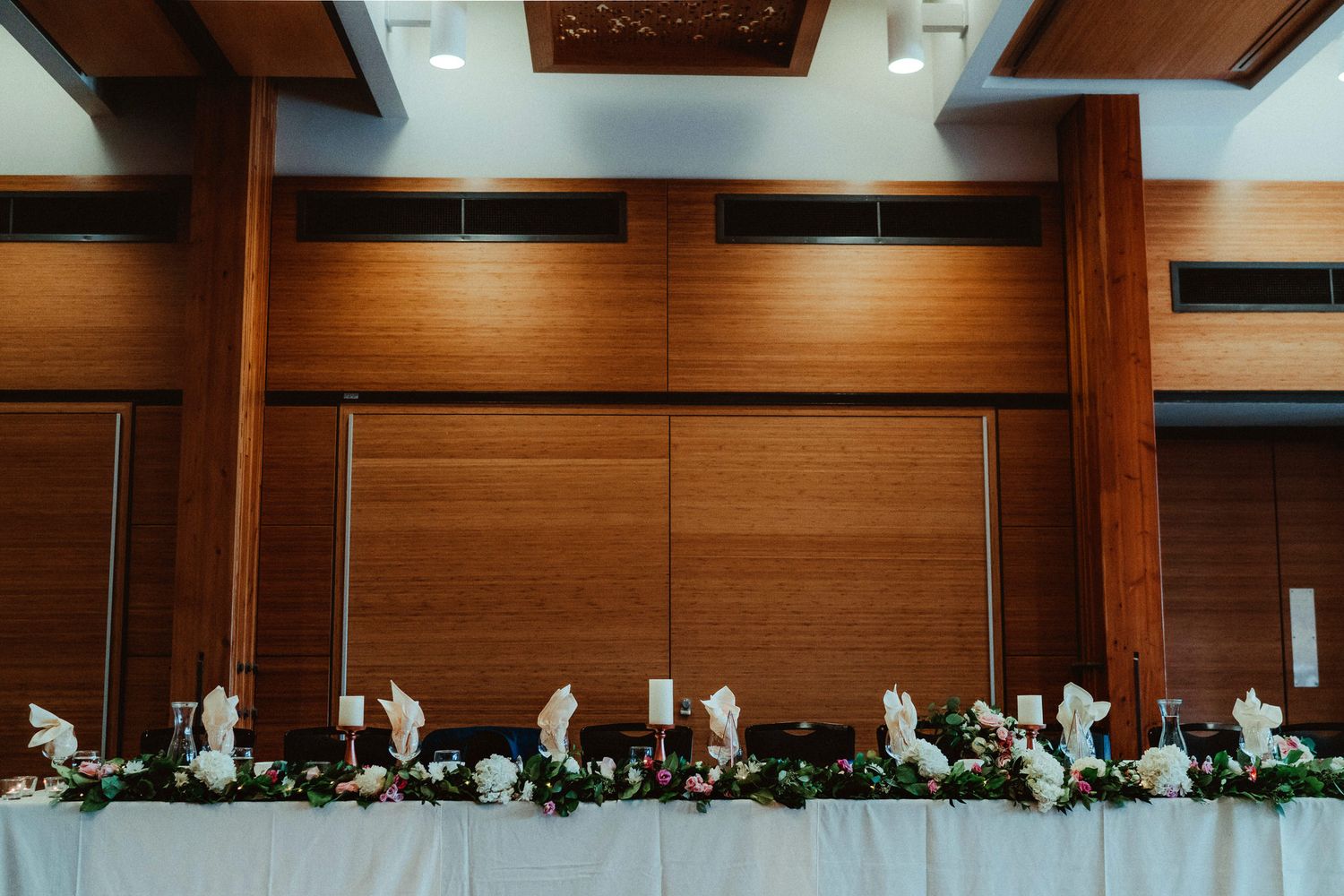 Elegant reception table setup at a Calgary Zoo wedding, captured by a Calgary wedding photographer focused on detail and atmosphere.