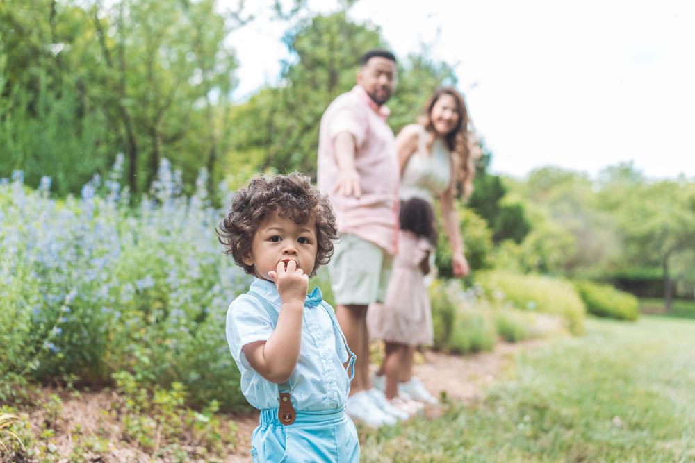 Series of candid family moments captured in outdoor garden setting.