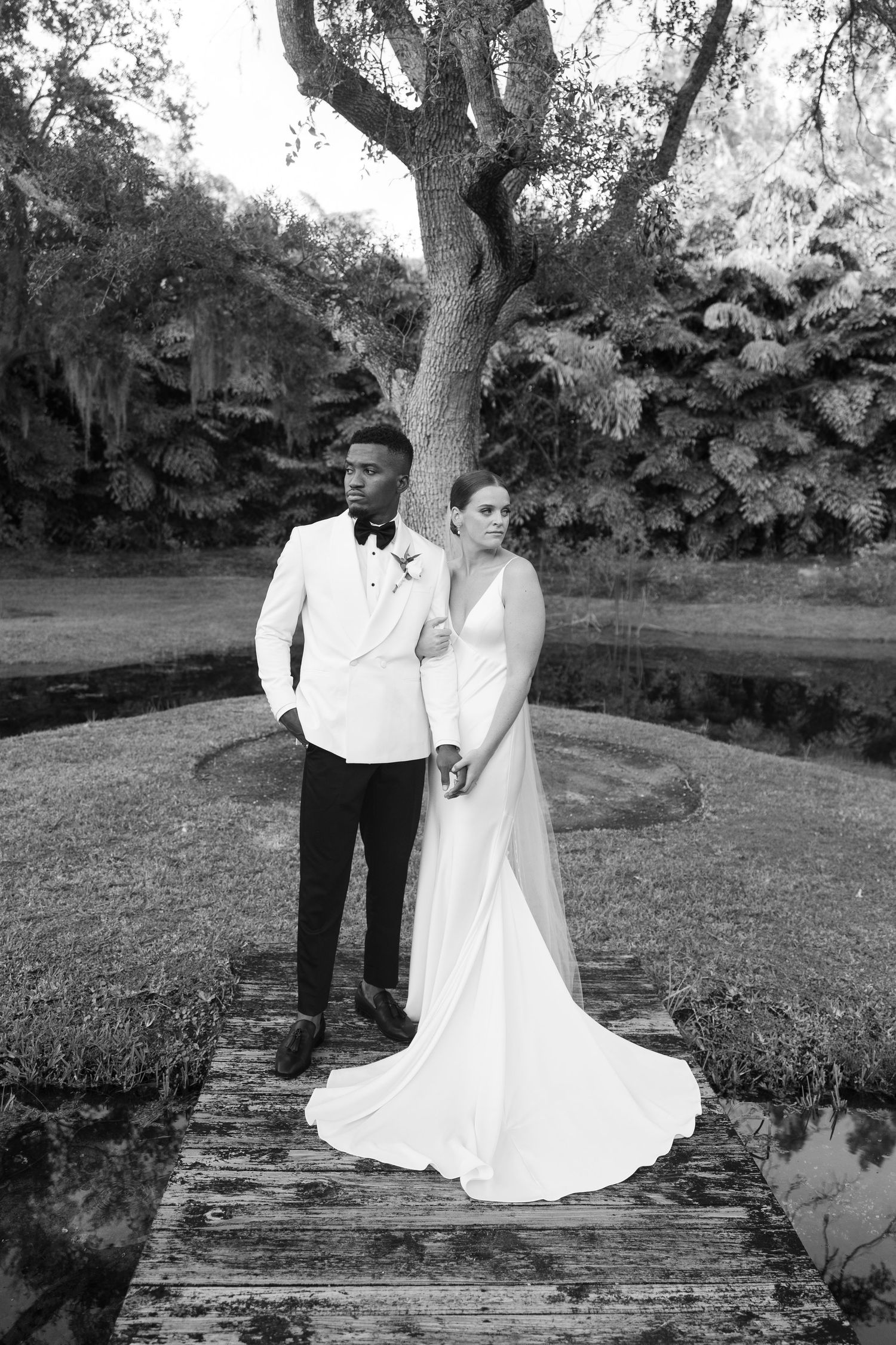 Golden Hour Bride & groom photos at wedding in Fort Pierce, FL at The Lake House venue captured by Lindsay McDow Photography. Vowd Weddings