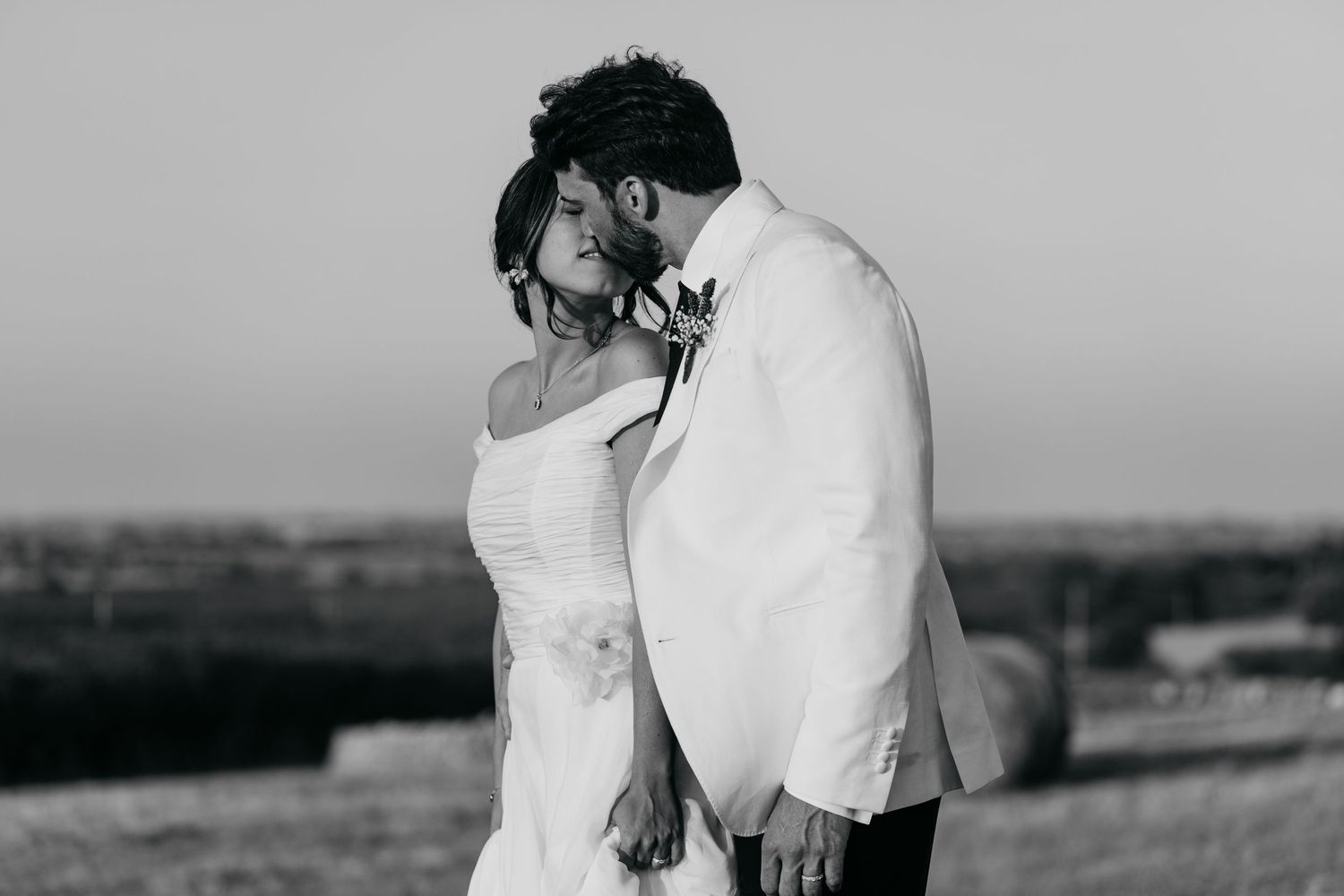 A dreamy sequence of portraits showing a couple in wedding attire against a soft, natural landscape.