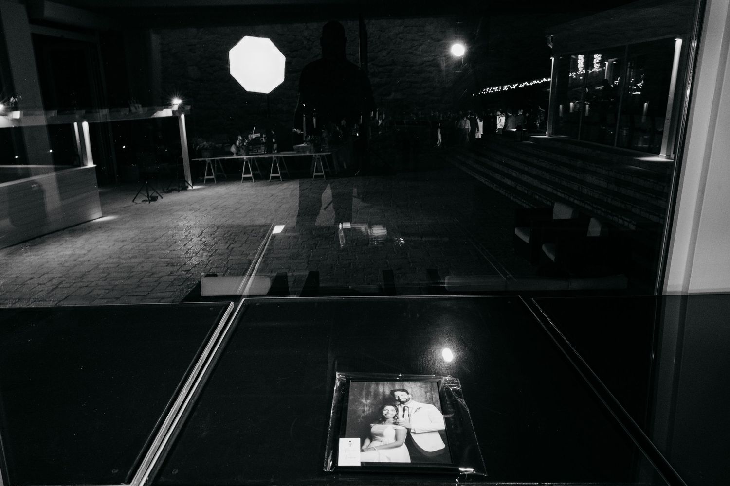 Dark dance floor illuminated by spotlights at a nighttime event venue.