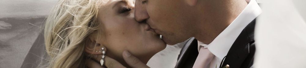 Close-up shot of a romantic intimate moment between newlyweds.