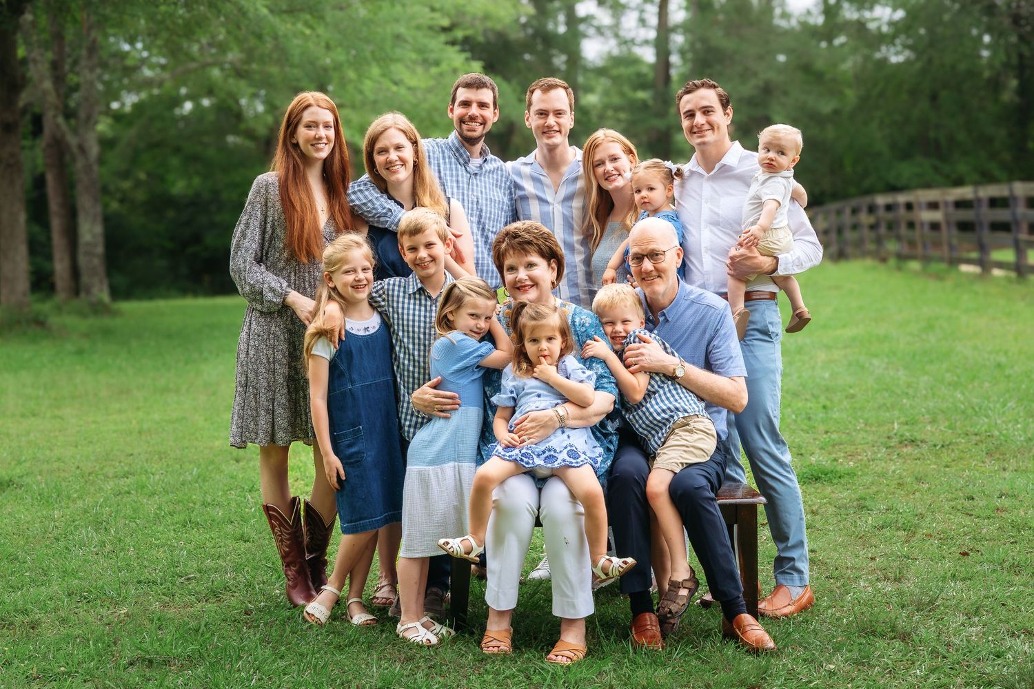 Family of four smile in tall grass during a family session in Athens, GA - Athens, Watkinsville & Bogart family photographer